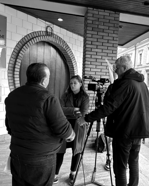 An Alliance representative talking to television outside the city hall in Vranje
